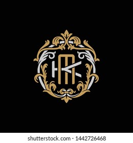 Initial letter K and M, KM, MK, decorative ornament emblem badge, overlapping monogram logo, elegant luxury silver gold color on black background