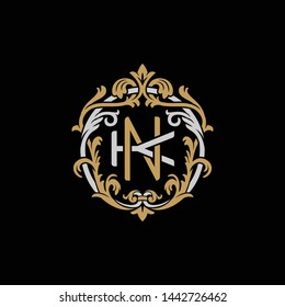 Initial letter K and N, KN, NK, decorative ornament emblem badge, overlapping monogram logo, elegant luxury silver gold color on black background