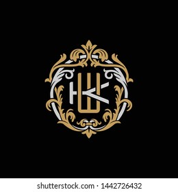 Initial letter K and W, KW, WK, decorative ornament emblem badge, overlapping monogram logo, elegant luxury silver gold color on black background
