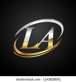 initial letter LA logotype company name colored gold and silver swoosh design. isolated on black background.
