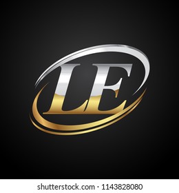 initial letter LE logotype company name colored gold and silver swoosh design. isolated on black background.
