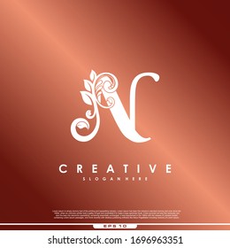 Initial letter logo N luxury beauty flourishes.