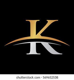 initial letter logo with swoosh silver gold