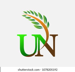 initial letter logo UN, Agriculture wheat Logo Template vector icon design colored green and brown.