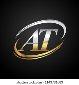 initial letter AT logotype company name colored gold and silver swoosh design. isolated on black background.