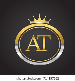 initial letter AT logotype company name with oval shape and crown, gold and silver color. vector logo for business and company identity.