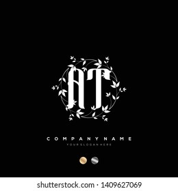 Initial AT letter luxury beauty flourishes ornament monogram logo - Vector