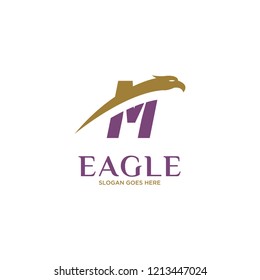 Initial Letter M Eagle Hawk Logo Design in Gold and Purple Colored