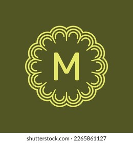 initial letter M floral alphabet circle emblem badge logo