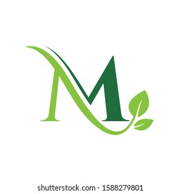 Initial Letter M With Leaf Luxury Logo. Green leaf logo Template vector Design.
