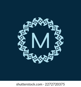 initial letter M ornamental emblem frame circle pattern logo