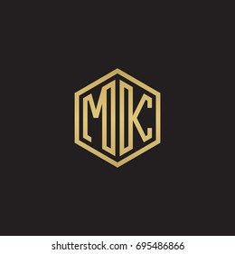 Initial letter MK, minimalist line art hexagon logo, gold color on black background