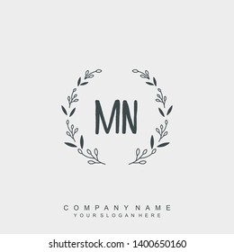 Initial letter MN beautiful handwriting logo vector template