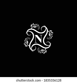 Initial Letter N Flourish circle monogram logo.