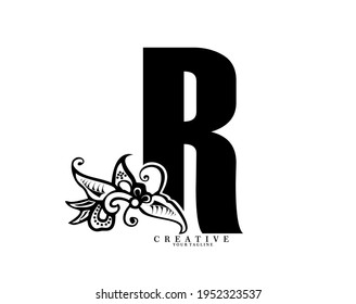 the initial letter R is in the form of a logo decorated with a batik pattern. beautiful, elegant, luxurious. black white monogram logo ornament. batik fonts