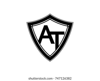 Initial letter AT shield logo black monogram vector illustration