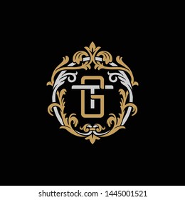 Initial letter T and G, TG, GT, decorative ornament emblem badge, overlapping monogram logo, elegant luxury silver gold color on black background