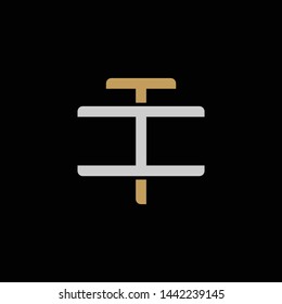 Initial letter I and T, IT, TI, overlapping interlock logo, monogram line art style, silver gold on black background