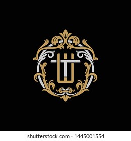 Initial letter T and W, TW, WT, decorative ornament emblem badge, overlapping monogram logo, elegant luxury silver gold color on black background
