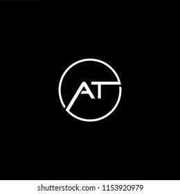 Initial letter AT TA minimalist art monogram shape logo, white color on black background.
