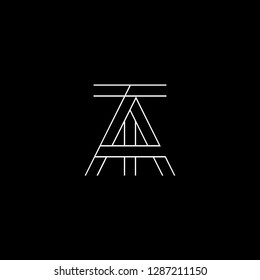 Initial letter AT TA minimalist monogram art logo, white color on black background.