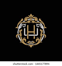 Initial letter U and H, UH, HU, decorative ornament emblem badge, overlapping monogram logo, elegant luxury silver gold color on black background