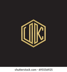 Initial letter UK, minimalist line art hexagon logo, gold color on black background