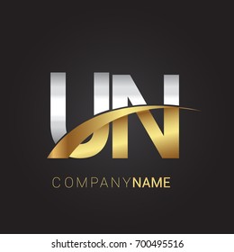 initial letter UN logotype company name colored gold and silver swoosh design. isolated on black background.