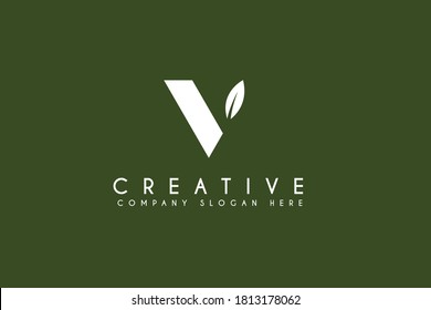 Initial letter V logo design with natural leaf.vector business and branding logo isolated on green background