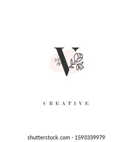 initial letter V logo with hand drawn flower element. design vector illustration symbol template