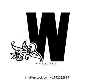the initial letter W is in the form of a logo decorated with a batik pattern. beautiful, elegant, luxurious. black white monogram logo ornament. batik fonts