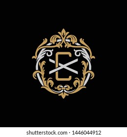 Initial letter X and C, XC, CX, decorative ornament emblem badge, overlapping monogram logo, elegant luxury silver gold color on black background