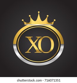 initial letter XO logotype company name with oval shape and crown, gold and silver color. vector logo for business and company identity.