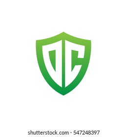 Initial letters DC, OC, shield shape green simple logo