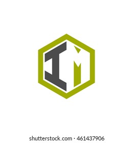 Initial letters IM negative space hexagon shape logo green black gray