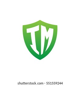 Initial letters IM shield shape green simple logo