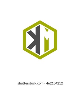 Initial letters KM negative space hexagon shape logo green black gray