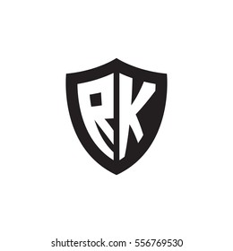 Initial letters RK shield shape black monogram logo
