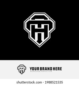 Initial letters T, A, TA or AT overlapping, interlocked monogram logo, black and white color on black background