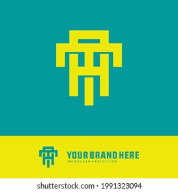 Initial letters T, A, TA or AT overlapping, interlocked monogram logo, yellow color on tosca background