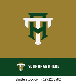 Anfangsbuchstaben T, A, TA oder AT, überlappend, eingeschlossenes Monogramm-Logo, weiße und grüne Farbe auf goldenem Hintergrund