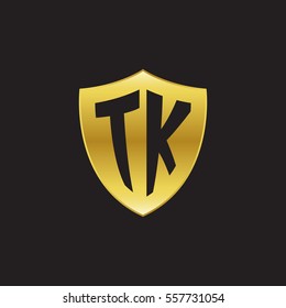 Initial letters TK shield shape gold logo