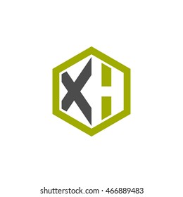 Initial letters XH negative space hexagon shape logo green black gray