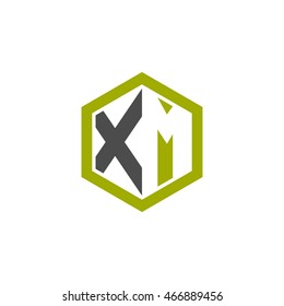 Initial letters XM negative space hexagon shape logo green black gray