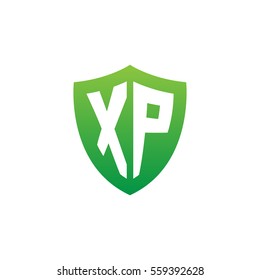 Initial letters XP shield shape green simple logo
