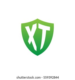 Initial letters XT shield shape green simple logo