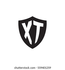 Initial letters XT shield shape black monogram logo