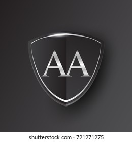 Initial logo letter AA with shield Icon silver color isolated on black background, logotype design for company identity.