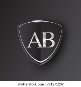 Initial logo letter AB with shield Icon silver color isolated on black background, logotype design for company identity.