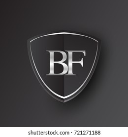 Initial logo letter BF with shield Icon silver color isolated on black background, logotype design for company identity.